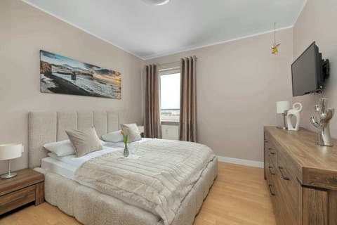 A cozy bedroom with a double bed, bedside tables, and soft neutral décor creating a calm atmosphere.