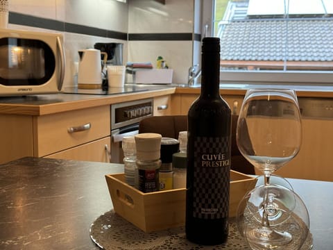 Bottle, Furniture, Drinkware, Cabinetry, Barware, Wine, Tableware, Table, Countertop, Kitchen Appliance