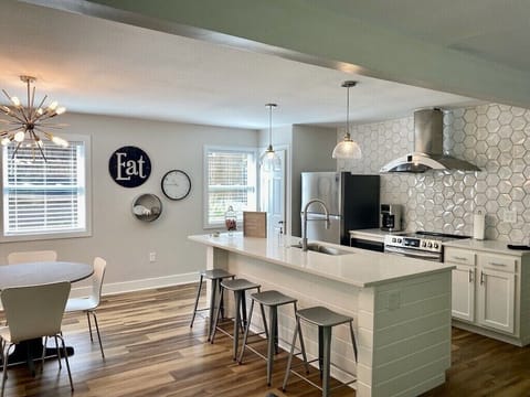 Fully furnished kitchen complete with toaster and coffee pot.