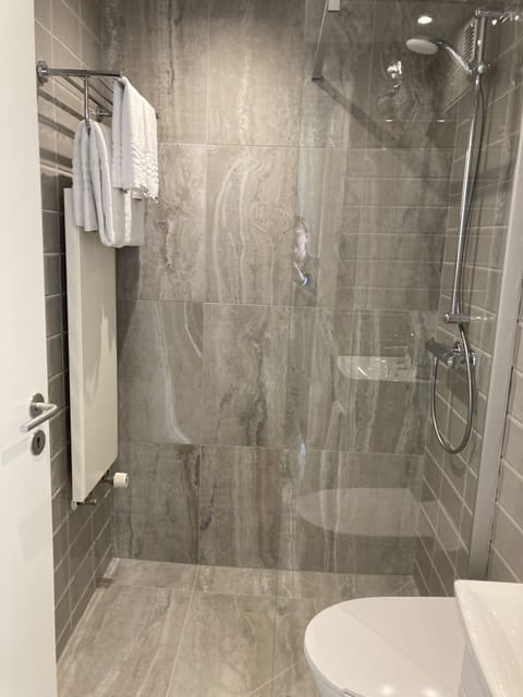 Shower, eco-friendly toiletries, hair dryer, towels