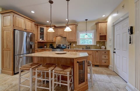 Kitchen with counter seating for 4- door on the right to garage