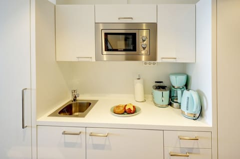 open kitchen with dining area and access to the living room