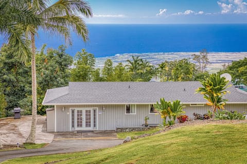 The house is located on the lower 1 1/2 acres surrounded by a large grass area. 