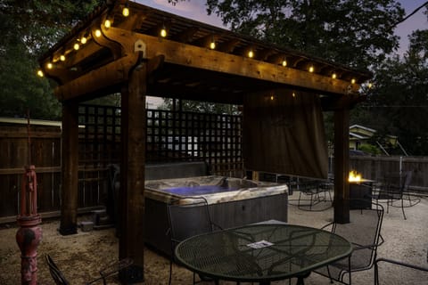 Unwind under the glow of bistro lights in your private hot tub—it’s the guest-favorite spot for stargazing with a glass of Texas wine in hand.