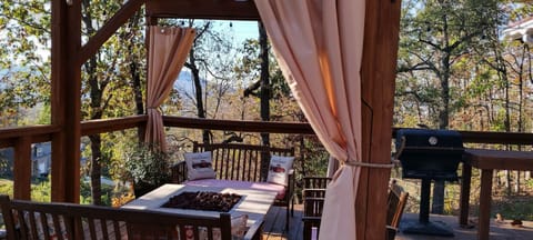 gas firepit nestled in trees