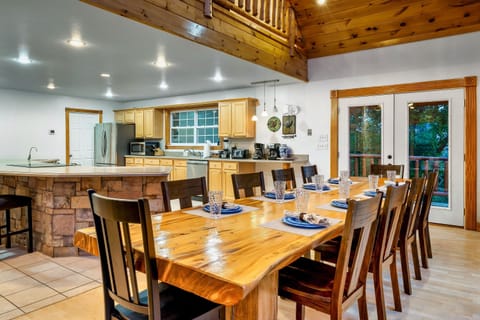 Open floor plan with gigantic dining room table that easily seats 10