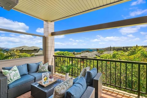 Wraparound oceanview lanai with cushioned seating and panoramic views of Kapalua.