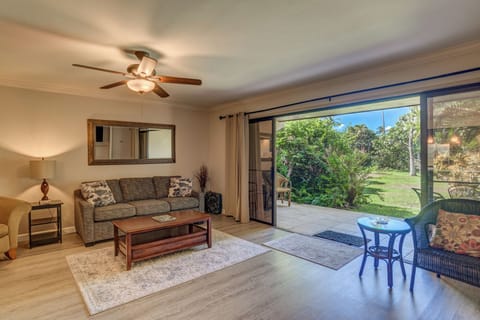 Bright and breezy living room opens directly to the spacious garden-view lanai for seamless indoor-outdoor living.