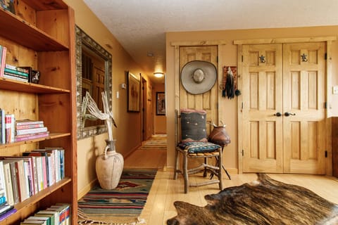 Rustic adobe cowboy ranch with antique artifacts and big skies.