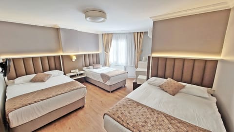 Family Room | Premium bedding, minibar, in-room safe, free WiFi
