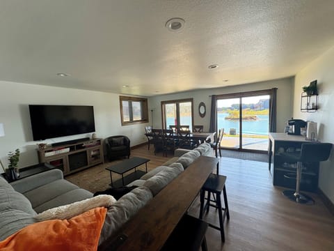 Basement living area with streaming TV and large table for games