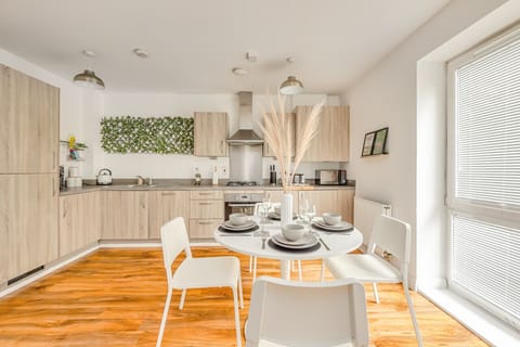 The apartment features a well-equipped kitchen complete with a fridge freezer, dishwasher, microwave, oven, hob, kettle, coffee machine and toaster. It's the perfect place to make a home-cooked meal.