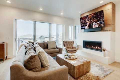 Spacious Great Room featuring HDTV, fireplace, Uinta mountain views