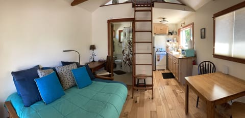 The ladder goes to the sleeping loft above.