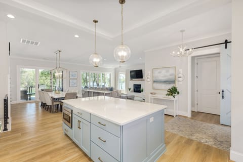 Open floor plan with open kitchen, living, dining areas great for entertaining