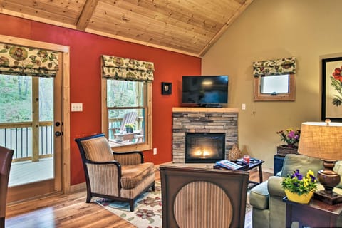 Light the fireplace and watch a show on the flat-screen TV.