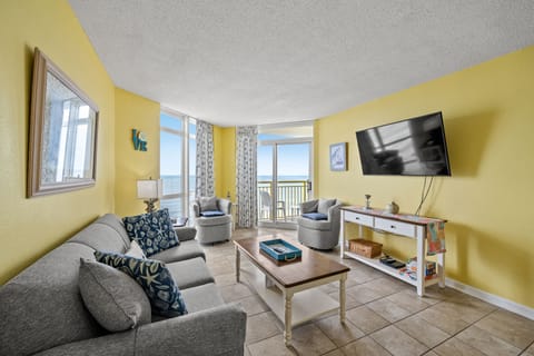 The ocean front living room is well-appointed with comfortable furnishings.