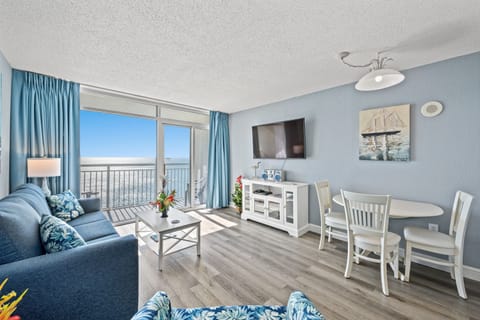 The ocean front living room is well-appointed with comfortable furnishings.
