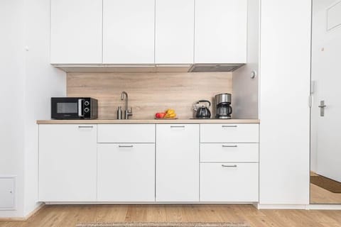 The kitchenette's practical layout maximizes space and functionality.