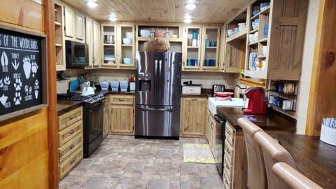 Full kitchen with dishwasher, microwave, gas range, Keurig, toaster, air fryer.