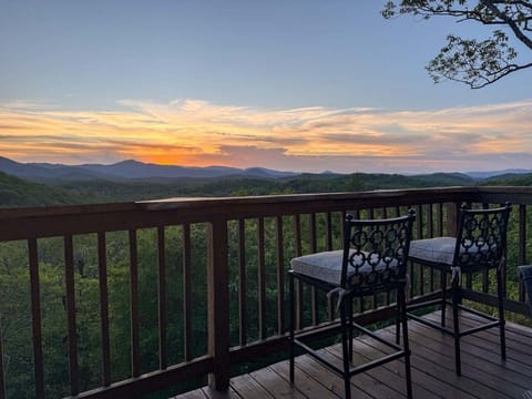 Sip your morning coffee or evening wine at the live-edge bar while taking in sweeping long-range Blue Ridge views.