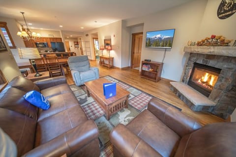 Cozy living area with fireplace and tv