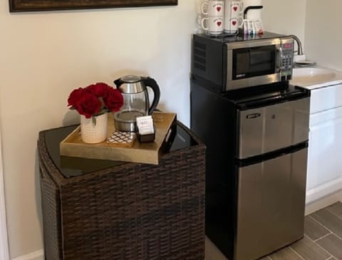 Minibar/bistro area with mini microwave and fridge