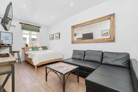 Relax in the stylish living area with a comfortable corner sofa and modern decor.