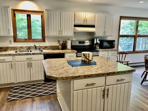 Kitchen - Fully equipped, cooking basics, dishware & flatware, microwave, toaster, drip coffee maker, trash bags, paper towels.