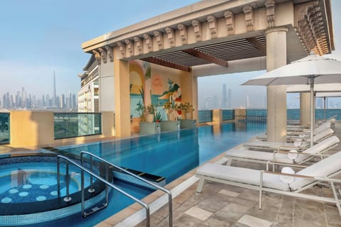 Outdoor pool, open 7:00 AM to 9:00 PM, pool umbrellas, sun loungers