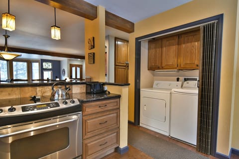 Washer & Dryer - Water/dryer unit on the main floor, accessible via the kitchen.