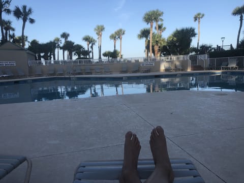 Relaxing summer evening by the pool.