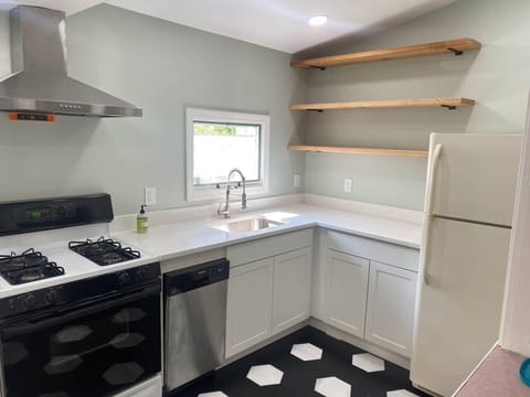 Updated kitchen with gas stove and dishwasher. 