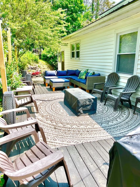Massive back patio with gas grill and fire pit. 
