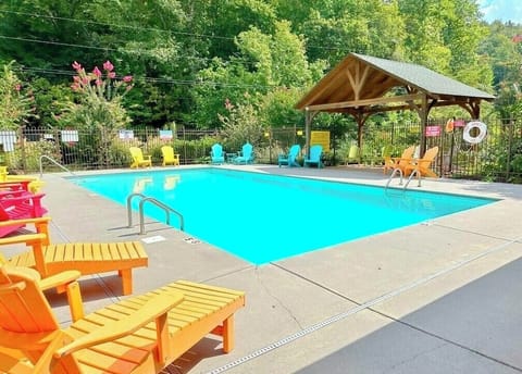 Our pool is in a peaceful setting with comfortable Polywood furniture.