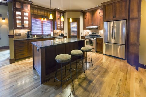 Open kitchen with island seating, gas range & oven, dishwasher & tons of storage