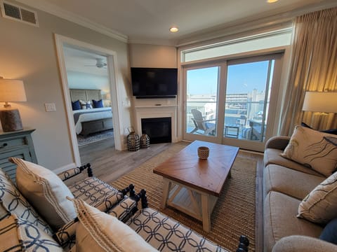 Living Area with pull-out sleeper sofa.  Gas fireplace.  Patio with bayviews.