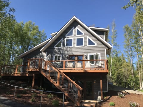 The back of the home with spectacular views from both inside and outside.