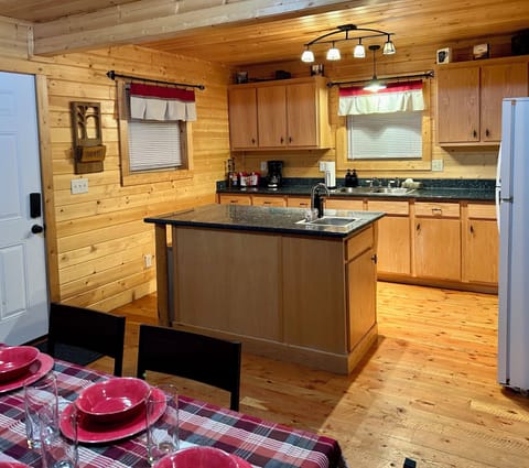 Kitchen equipped with coffee bar and lots of natural light.