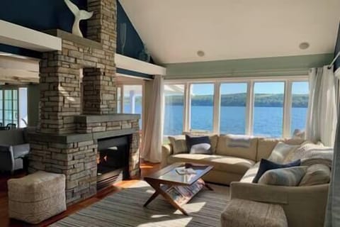 Living room with fireplace and lake view