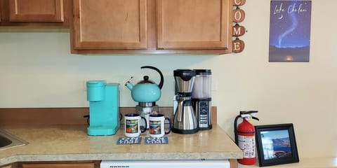Ninja drip pot, Keurig and Teakettle, with an assortment of coffees and teas.