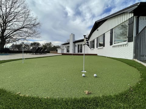 4 hole putting green with putters and balls 
Kid and adult clubs