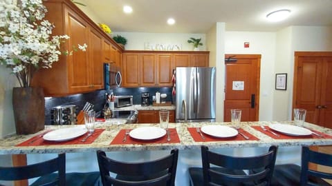 Kitchen is stocked with enough plates, silverware, and glasses for everyone

