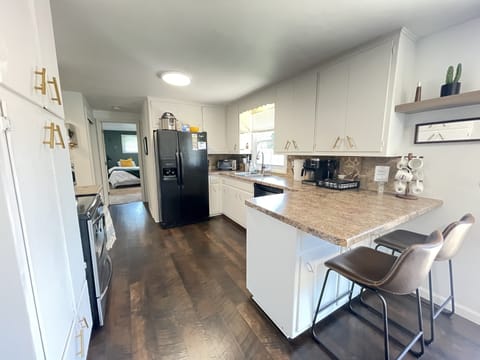 Fully stocked kitchen with sitting area