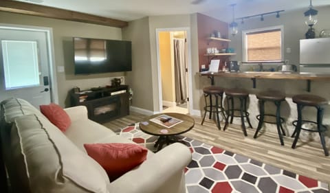 Main room showing location of the bathroom and view of the kitchenette area. 