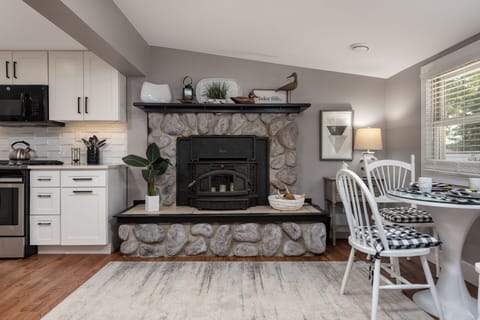 Fireplace adds a warm feeling to the eat in kitchen. Non function in summer.
