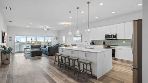 Oversized quartz countertops, 10-foot ceilings, and open concept beach vibes