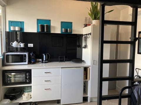 Kitchenette , view from day bed ground floor and steps to mezzanine floor