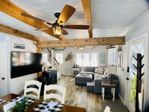 Large TV with several streaming apps included, large sectional sofa