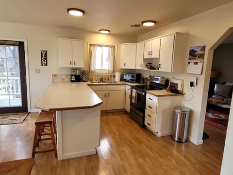 Kitchen and eating area with seating for 4.